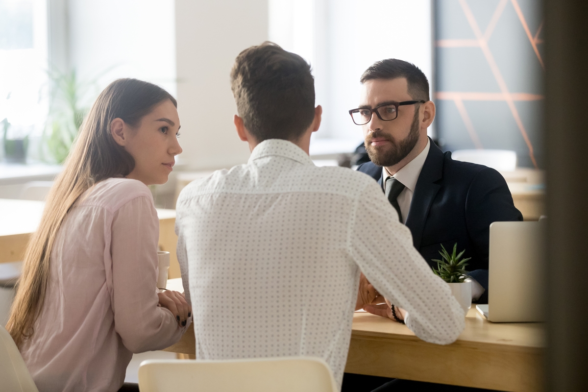 Mortgage broker listening to clients